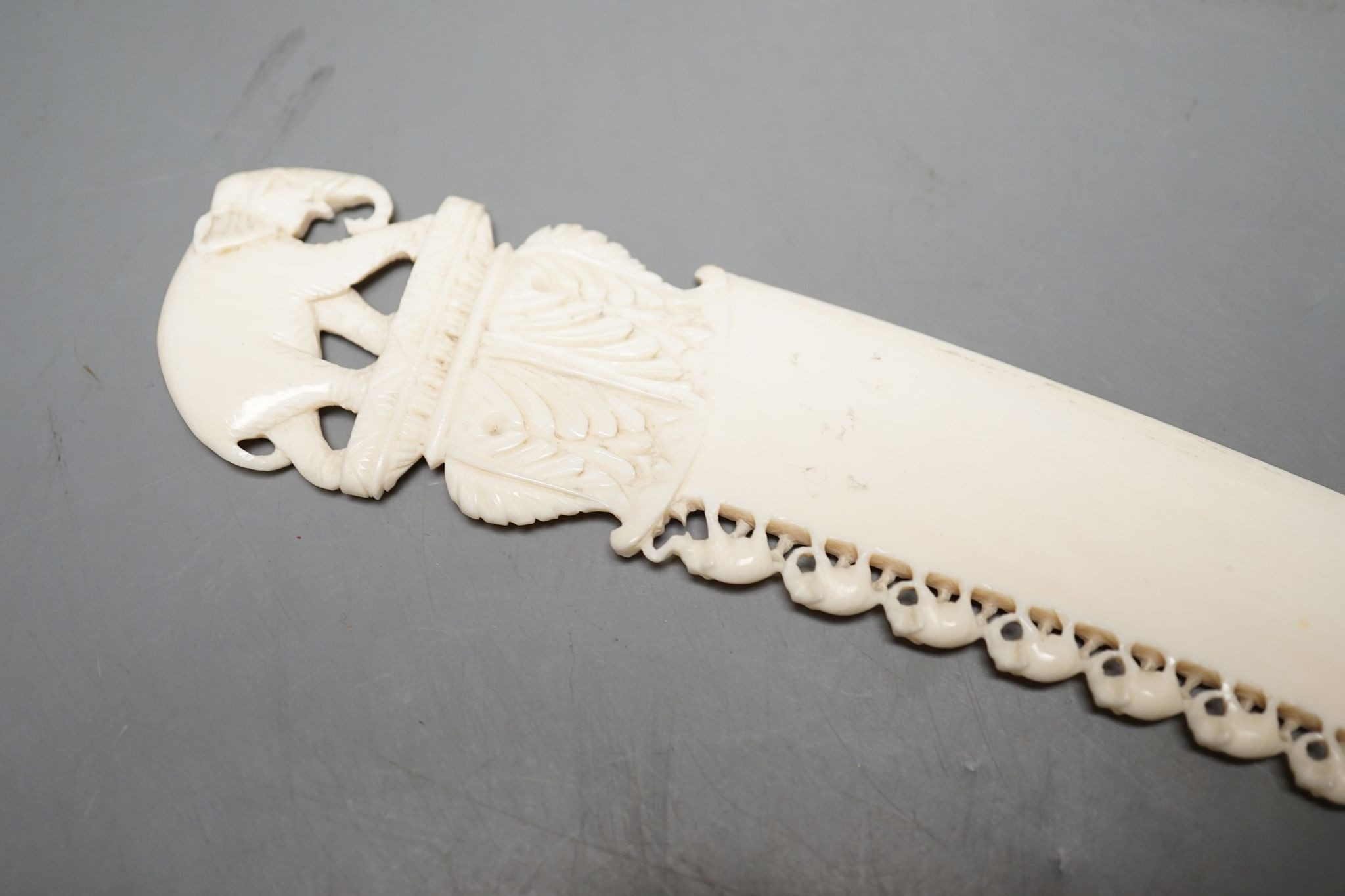 An Indian ivory letter opener, 38cm, and a Ganesh figure
